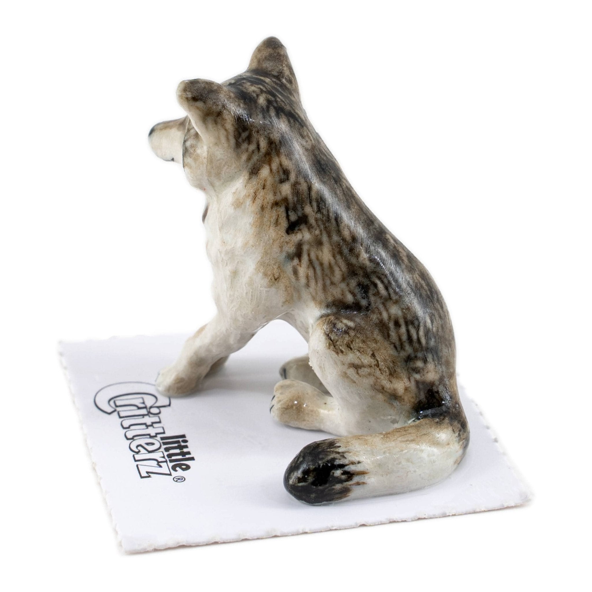 Akela Wolf Sitting Porcelain Miniature - Spiral Circle