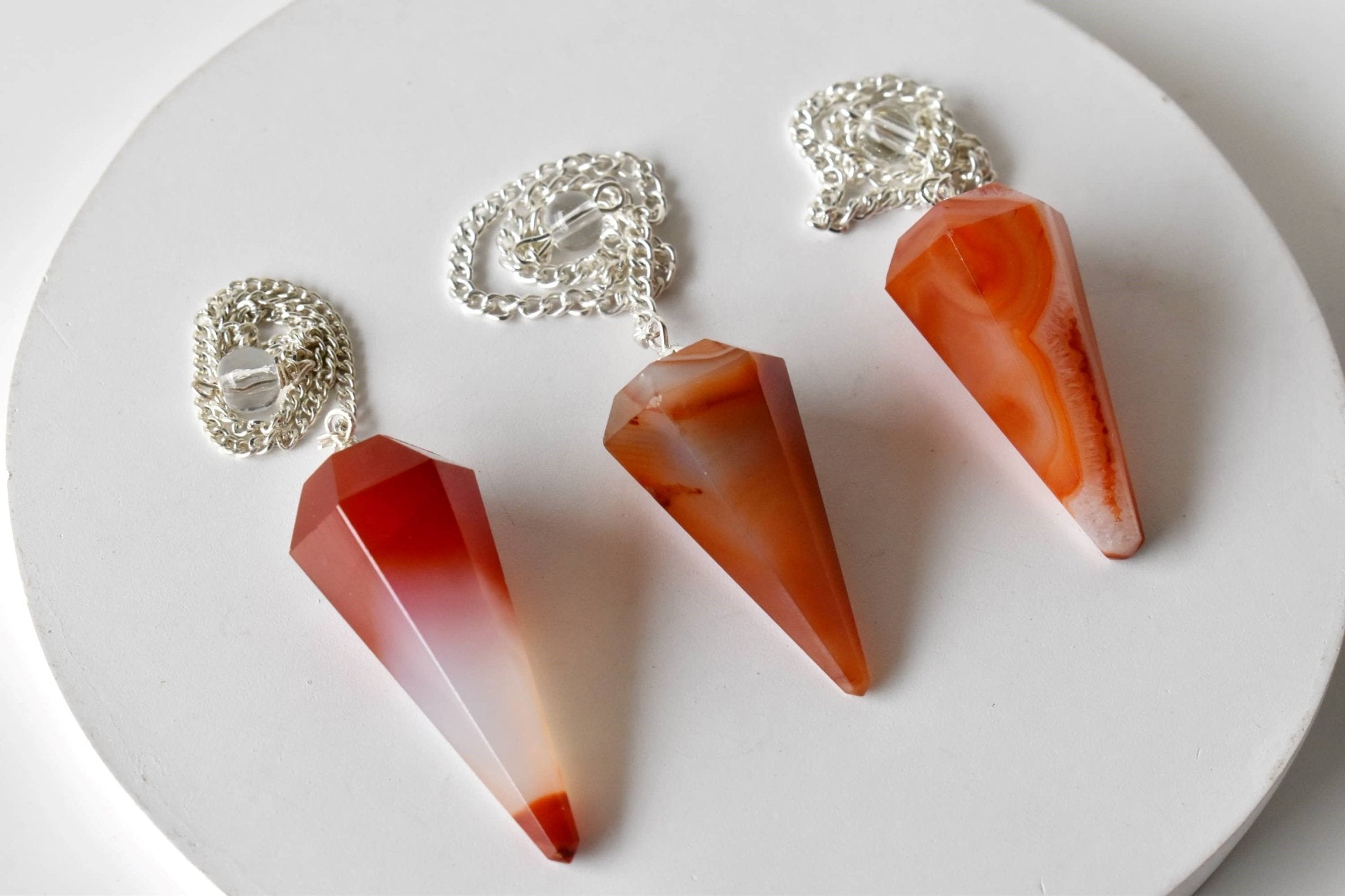Dowsing Pendulum | Carnelian | Faceted Crystal Pendulum - Spiral Circle