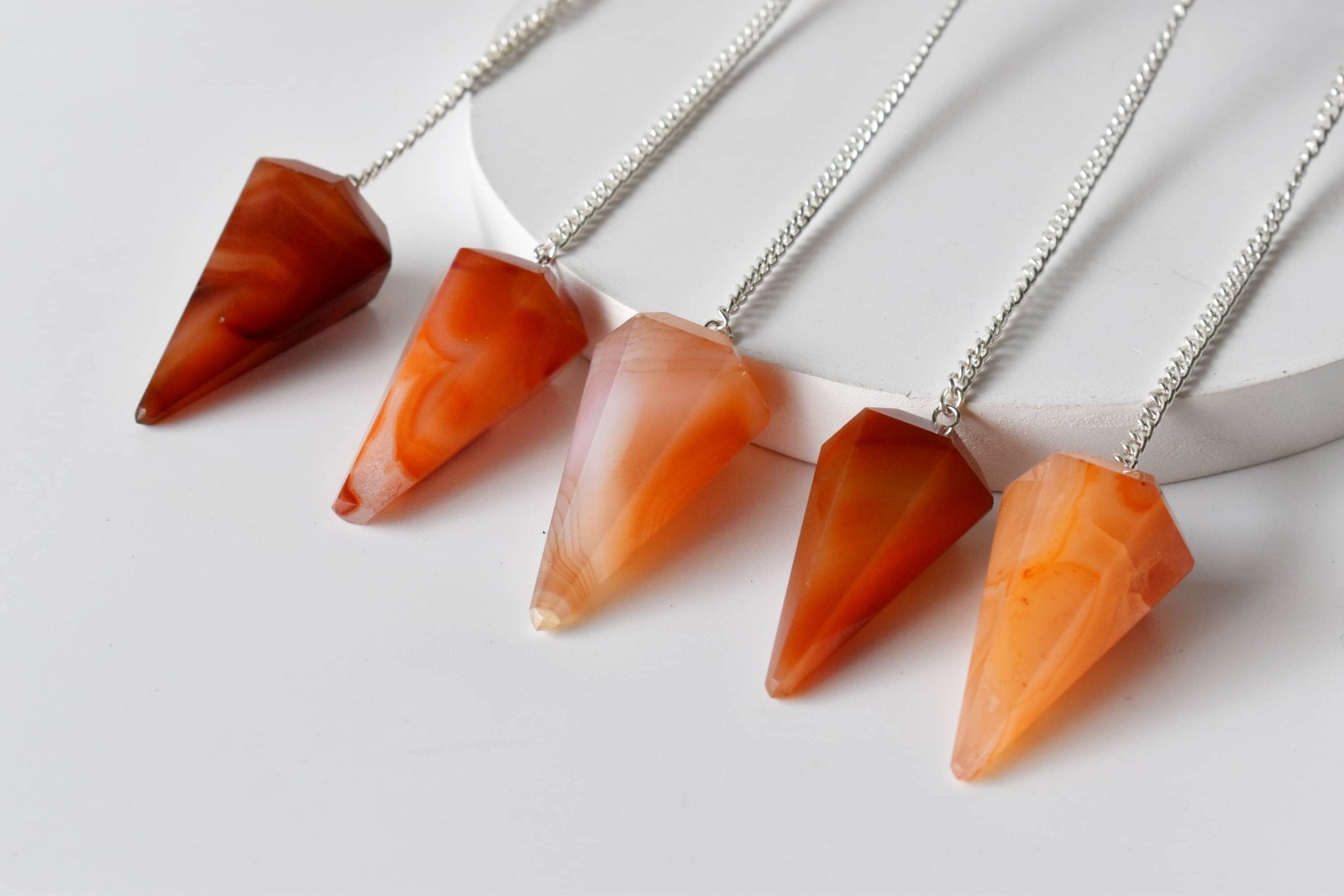 Dowsing Pendulum | Carnelian | Faceted Crystal Pendulum - Spiral Circle