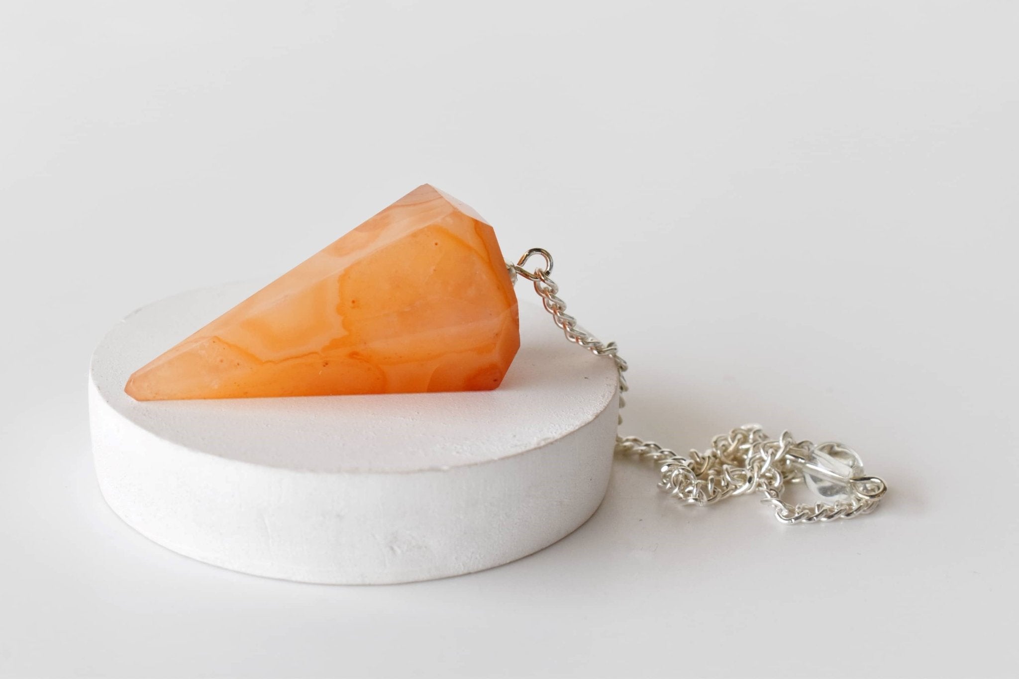 Dowsing Pendulum | Carnelian | Faceted Crystal Pendulum - Spiral Circle
