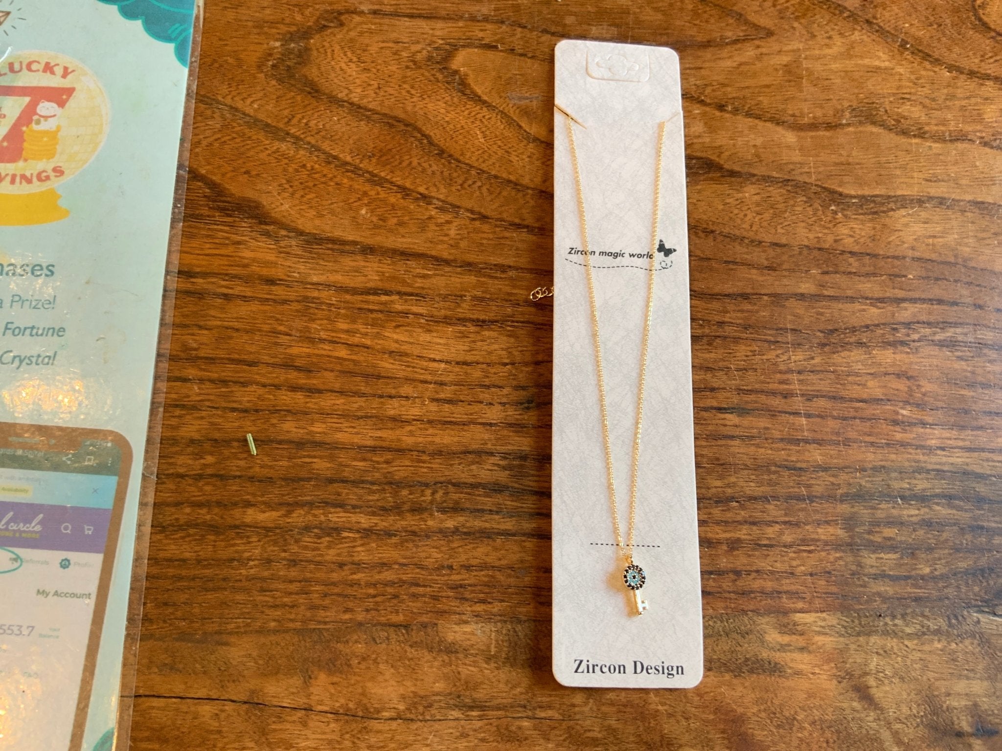 Evil Eye Key on Gold tone chain - Spiral Circle