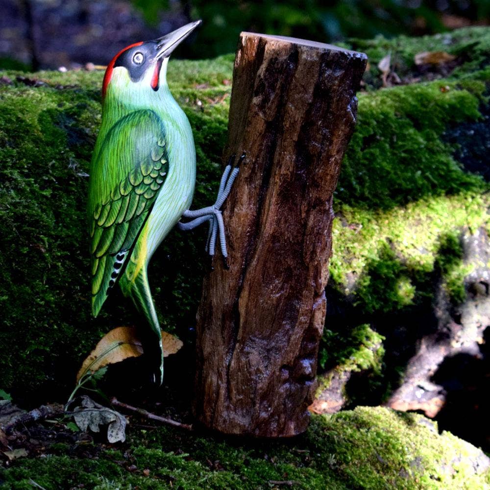 Green woodpecker on tree trunk, hand carved and painted - Spiral Circle