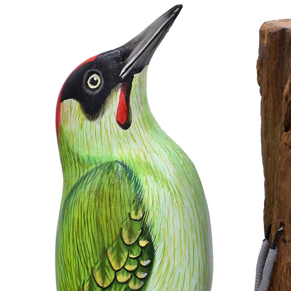 Green woodpecker on tree trunk, hand carved and painted - Spiral Circle