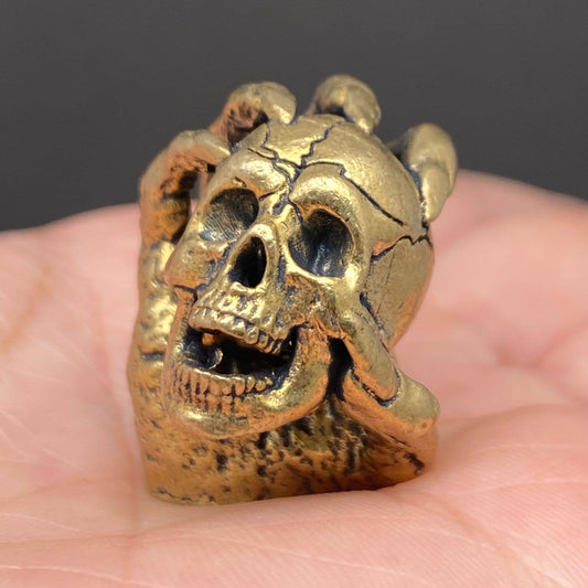 Skull In Hand | Brass Figurine - Spiral Circle