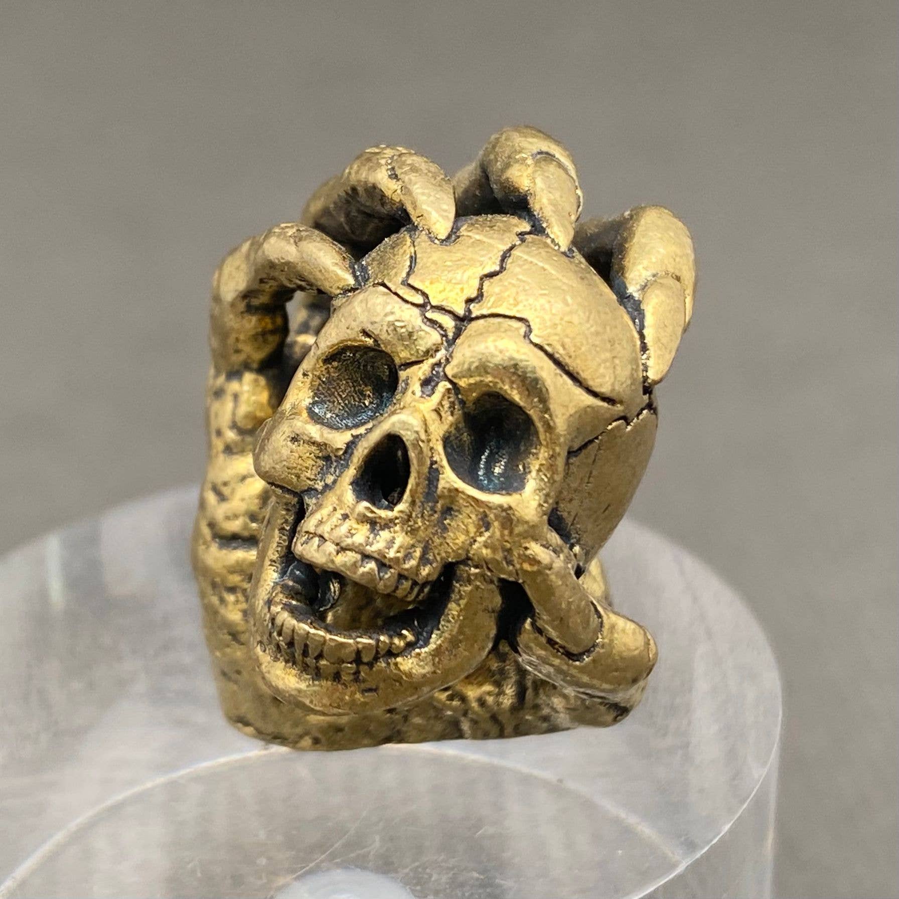 Skull In Hand | Brass Figurine - Spiral Circle