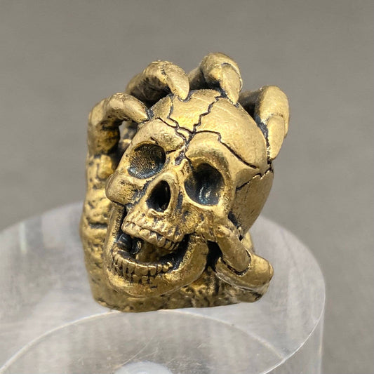 Skull In Hand | Brass Figurine - Spiral Circle