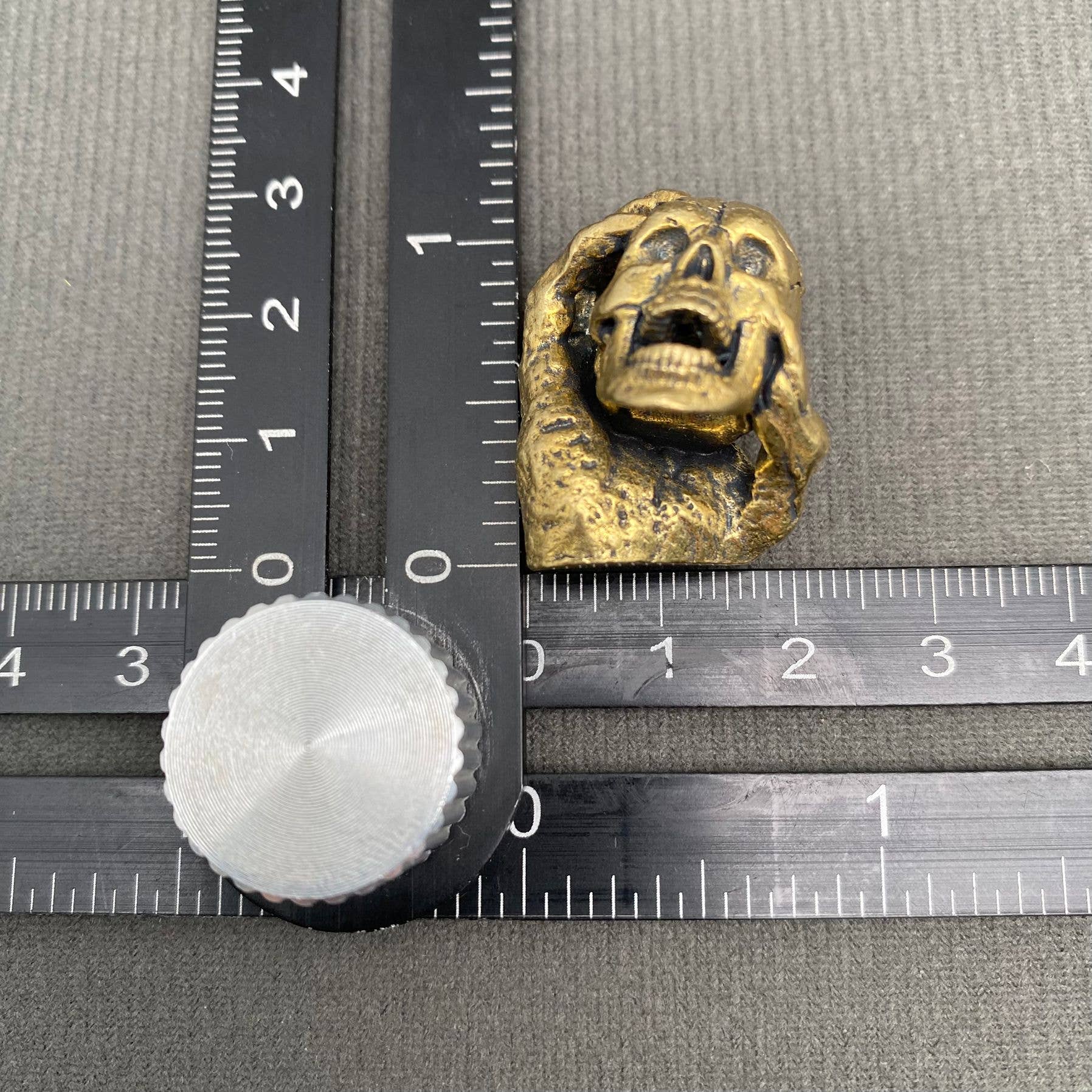 Skull In Hand | Brass Figurine - Spiral Circle