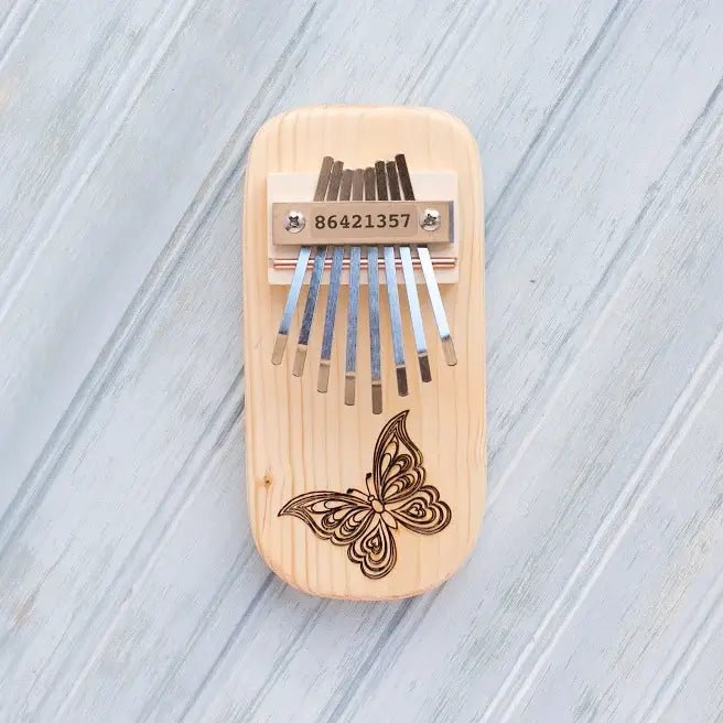 Butterfly Engraved Thumb Piano: Low Diatonic / Pine - Spiral Circle