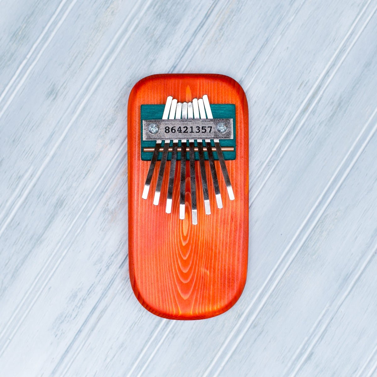 Color Pine Thumb Piano | Orange - Spiral Circle