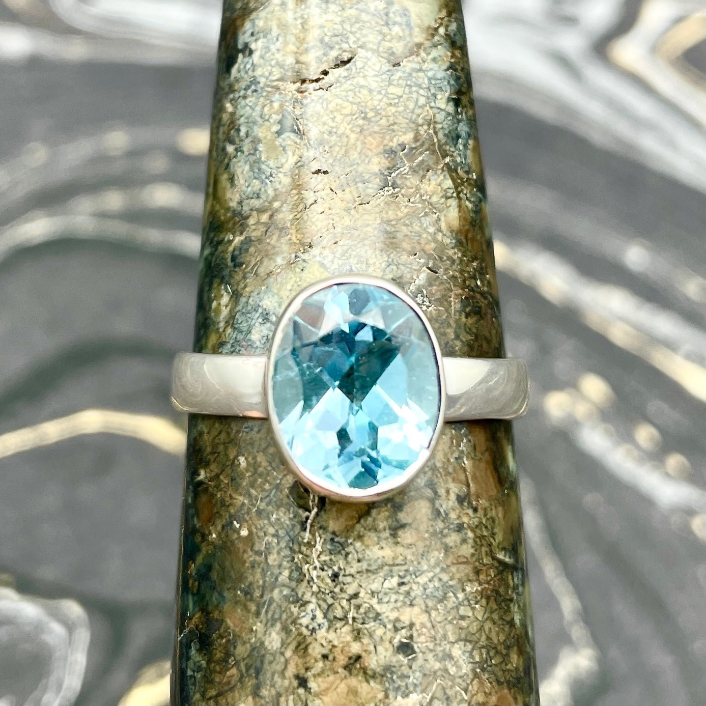 Sky Topaz Faceted Ring | Sterling Silver - Spiral Circle